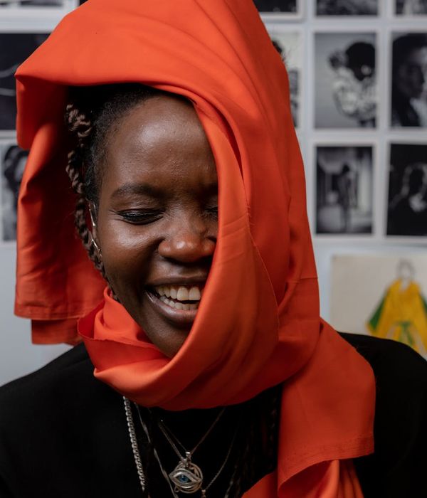 Woman feeling vibrant and full of energy in a bright, modern space.